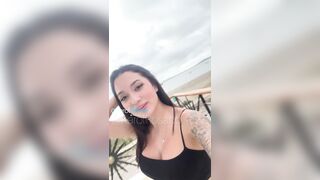 Karol Rosado masturbating on a balcony at the beach.