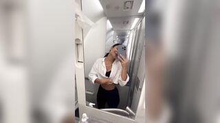Hot Latina girl masturbating in the airplane bathroom