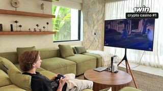 MilaMuse sucks her boyfriend's cock while he plays in the living room